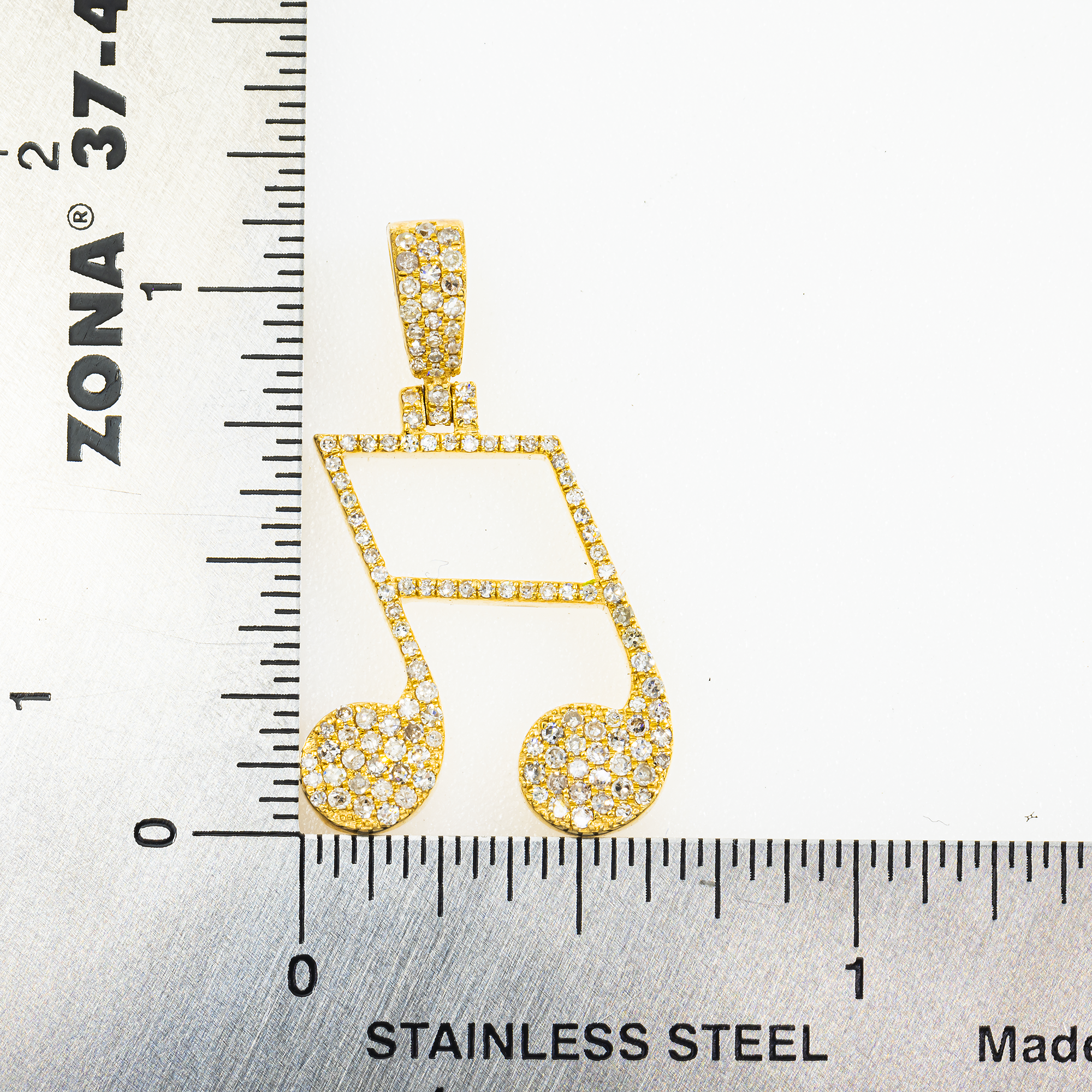 10K GOLD DIAMOND MUSIC NOTE PENDANT 0.56 CT